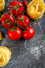 Italian food concept pasta ingredients on grey stone desk background top view copyspace close up