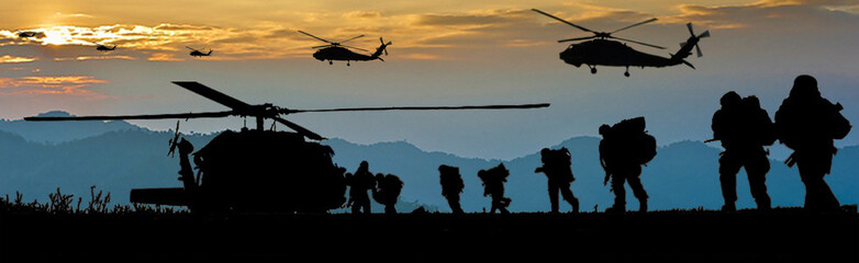 Military silhouette, walk into battle in the evening.