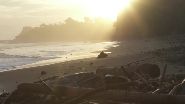 lightful sunset at bali beach cliff                               