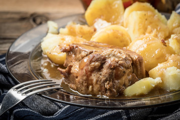 Stewed pork meat served with potatoes