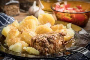 Stewed pork meat served with potatoes