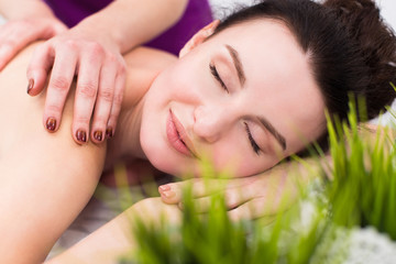 Obraz na płótnie Canvas Smiling client at a massage session