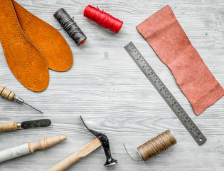 Work desk of clobber. Skin and tools on grey wooden desk background top view copyspace