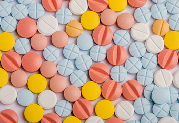 many pills white yellow blue red health