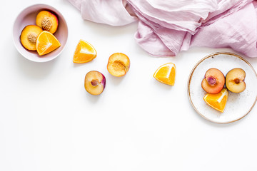 napkin, cut peach and orange for exotic fruit on white background top view mockup
