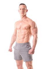 Fototapeta premium fit muscular man posing isolated in white
