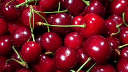 Great background of fresh, ripe, juicy cherries. Rotating turntable.