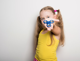 cheerful child with a bright spinner