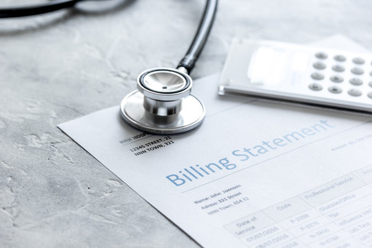 Stethoscope, Billing Statement For Doctor's Work In Medical Center Stone Background