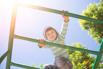 Active  happy little boy on playground..