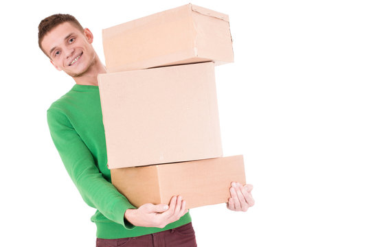 Young delivery man hold boxes. so funny. isolated white background.
