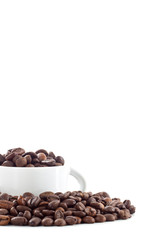 White cup and coffee beans