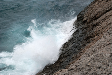 Waves beat against rocks