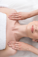 Pleasant girl is resting in cosmetics cabinet