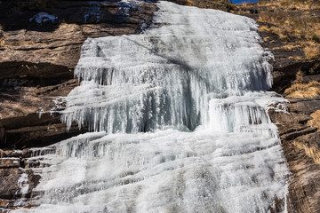 Freezing waterfall that flew from the mountain at Lachen. North Sikkim, India.