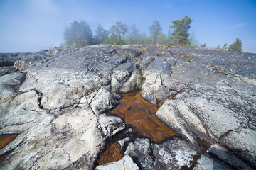 Puddle in a rock on an island in the Ladoga lake