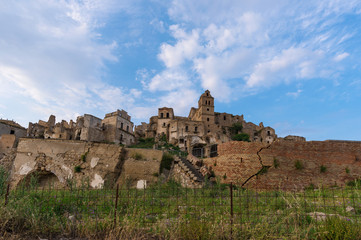 Craco (Italy) - The evocative ruins and landscapes of the ghost town scattered among the badlands hills of the Basilicata region, beside Matera, destroyed by a landslide and abandoned.