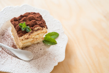 Tiramisu coffee cake served on a white plate