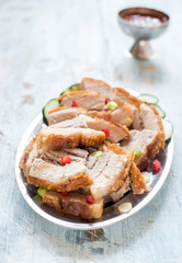 Split roasted pork belly served in the plate,selective focus