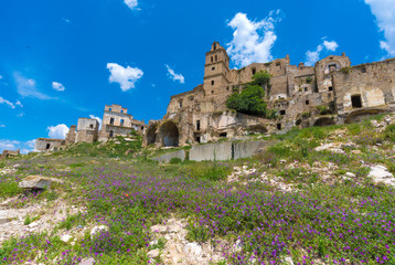 Craco (Italy) - The evocative ruins and landscapes of the ghost town scattered among the badlands hills of the Basilicata region, beside Matera, destroyed by a landslide and abandoned.