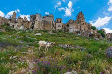 Craco (Italy) - The evocative ruins and landscapes of the ghost town scattered among the badlands hills of the Basilicata region, beside Matera, destroyed by a landslide and abandoned.