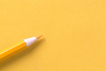 Yellow crayon on yellow paper