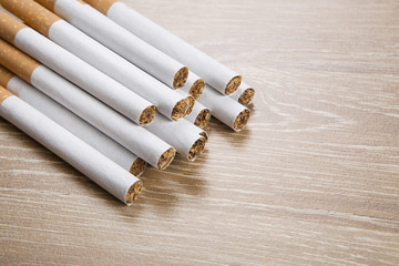 Cigarettes on brown background