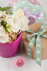 Arrangement of eustoma flowers in pot, pastel gift box