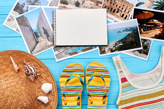 Set of summer accessories, photos. Female beach items, paper notebook, sea background.