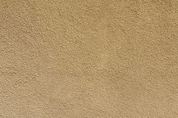 Texture yellow plastered wall for background. Yellow textured painted wall