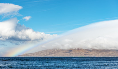 kihei coast maui hawaii with rainbow and clouds