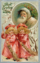 Fototapeta na wymiar Father Christmas and two girls sweeping the snow. Date: circa 1905
