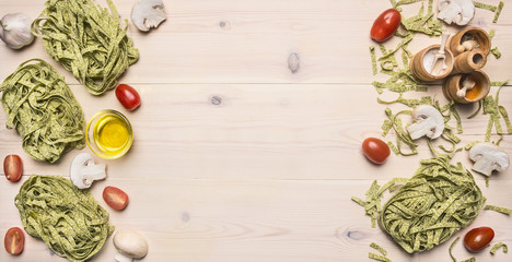 healthy foods, cooking and vegetarian concept green pasta with cherry tomatoes, spices and Champignon,, Border, place for text