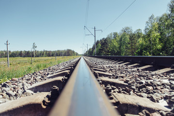 Fototapeta na wymiar Railway track to the up country. Railway rail close-up, background, wallpaper.