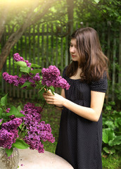 teenager girl with lilac violet flowers