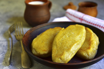 Fried zeppelin (cepelinai) - tradishional lithuanian potato patty stuffed with meat. © lilechka75