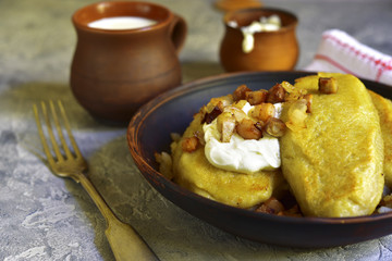 Fried zeppelin (cepelinai) - tradishional lithuanian potato patty stuffed with meat.