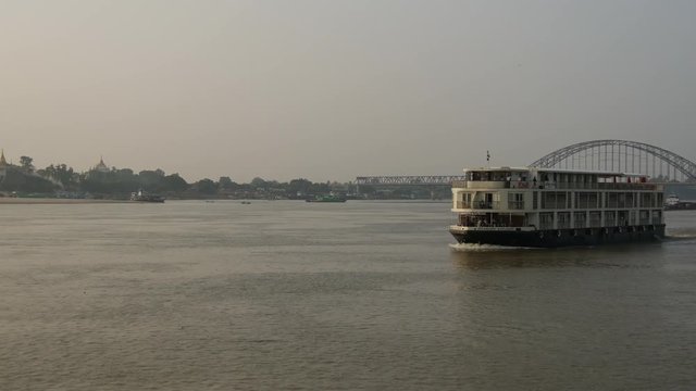 Cruise ship passing by at the Ayeyarwady river, Myanmar, Burma