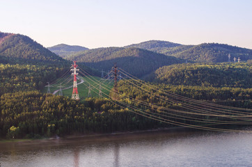 Power lines on the river bank