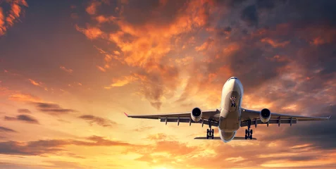 Peel and stick wall murals Airplane Landing airplane. Landscape with white passenger airplane is flying in the blue sky with clouds at colorful sunset. Travel background. Passenger airliner. Business trip. Commercial aircraft. Concept