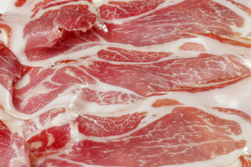 Classic spanish tapas: sliced ham served on a dish. Spanish name Jamon Iberico.