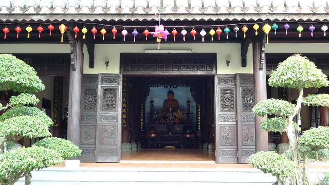 Entrance of the temple with lanterns at the Chuc Thanh Pagoda in Hoi An Vietnam