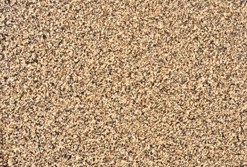 A wall similar to a cork tree. Cork wall. Brown and yellow specks.