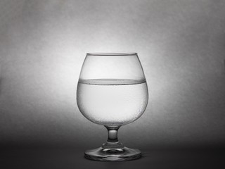 Cup of cold water isolated on soft light in backgtound