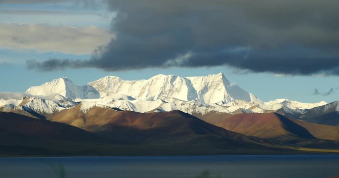 4k,time lapse of huge clouds mass rolling over lake namtso & Tanggula snow mountain peak,tibet mansarovar,Tibet's second largest lake,is the third largest saltwater lake in China,roof of the World.