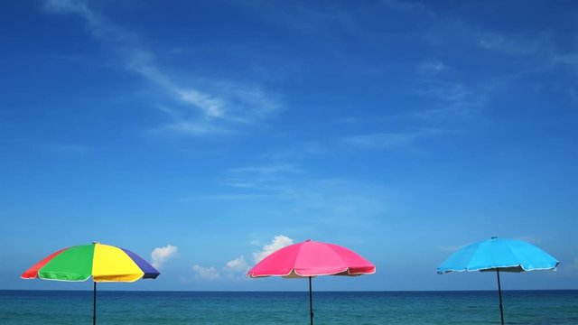 Colorful Umbrellas provide Shade at Surin Beach, Phuket, Thailand