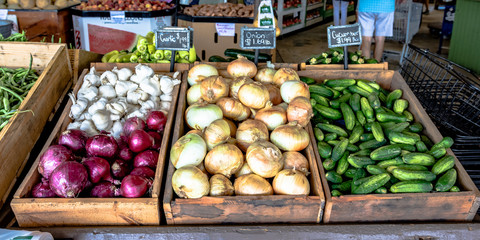 Vegetables on display at a produce stand - Powered by Adobe