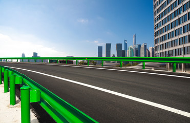 Empty road surface floor with city landmark buildings