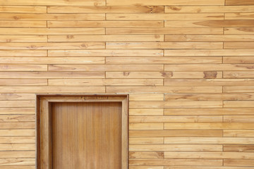 Wooden Wall by stacking or arrange of wood peices and smooth surface, nail together, half door at corner