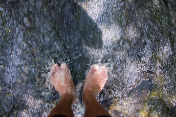 Legs relaxing waterfall plunge